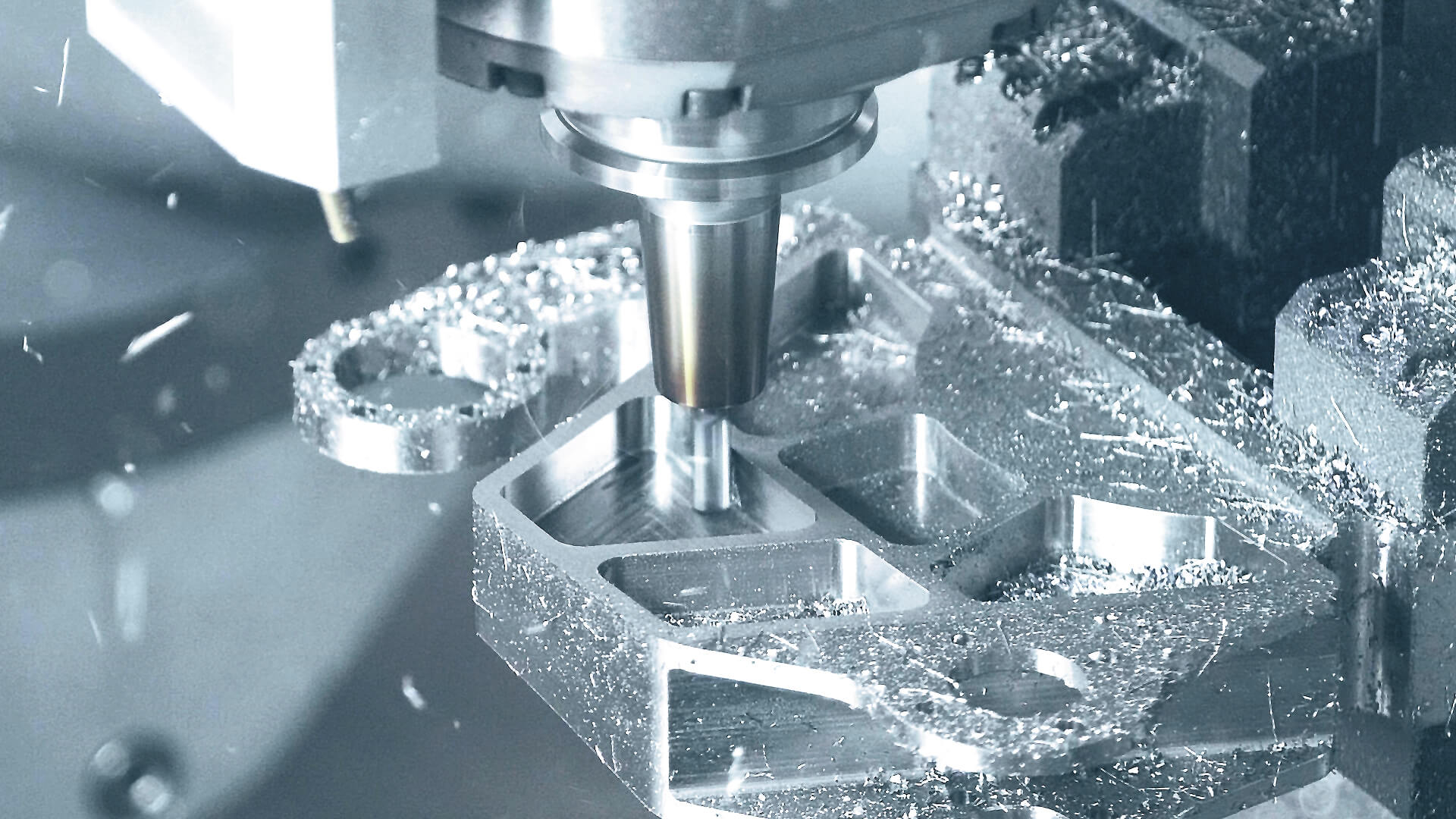 A CNC (Computer Numerical Control) machine automates precision machining tasks, enabling efficient production of complex parts with high accuracy and repeatability.